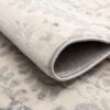 Close-up of a textured beige carpet.
