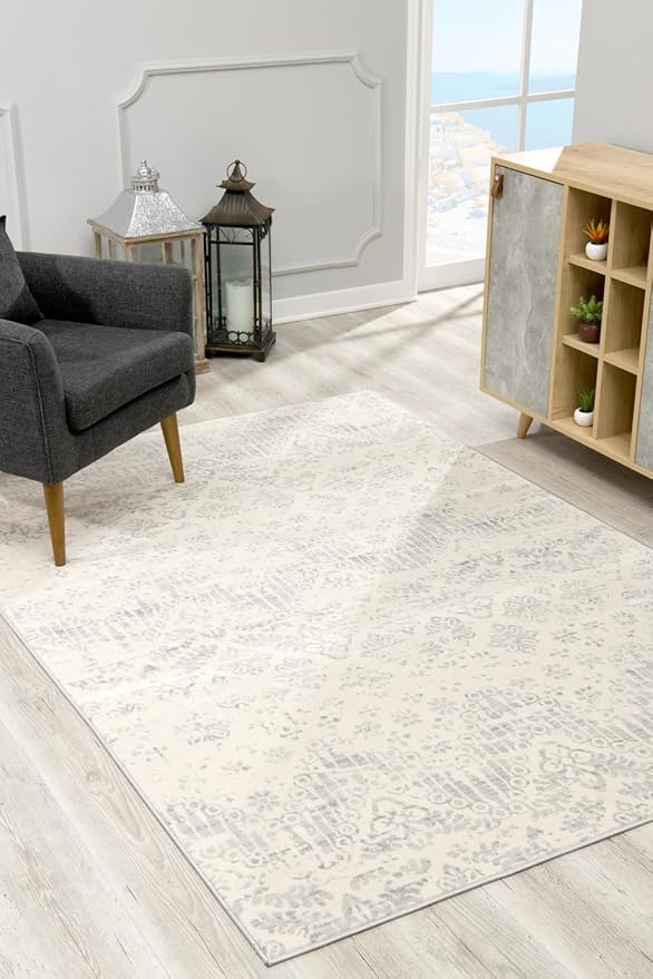 Modern living room with patterned rug and armchair.