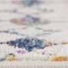 Close-up of colorful patterned rug edge.