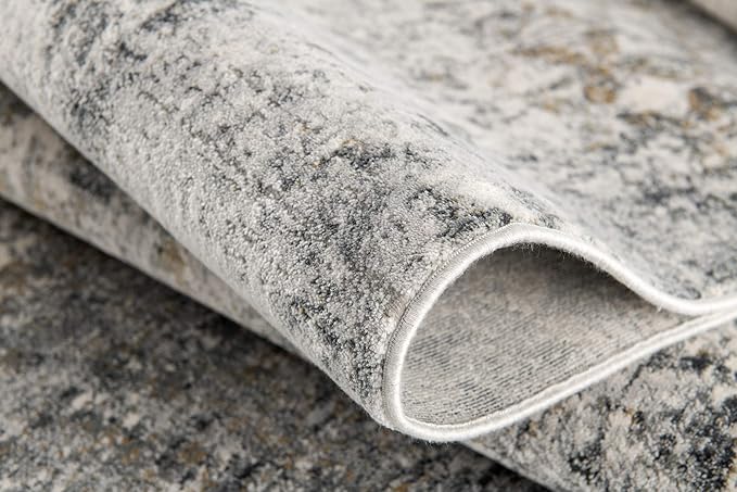 Close-up of textured gray carpet fold.