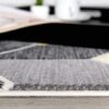Geometric gray rug on wooden floor