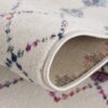 Close-up of folded floral patterned rug