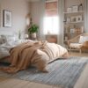 Cozy bedroom with modern decor and natural light.