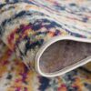 Close-up of colorful textured rug edge.