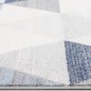 Geometric patterned fabric in blue and gray shades.