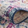 Colorful patterned rug close-up with floral design.