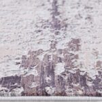 Close-up of textured abstract rug pattern.