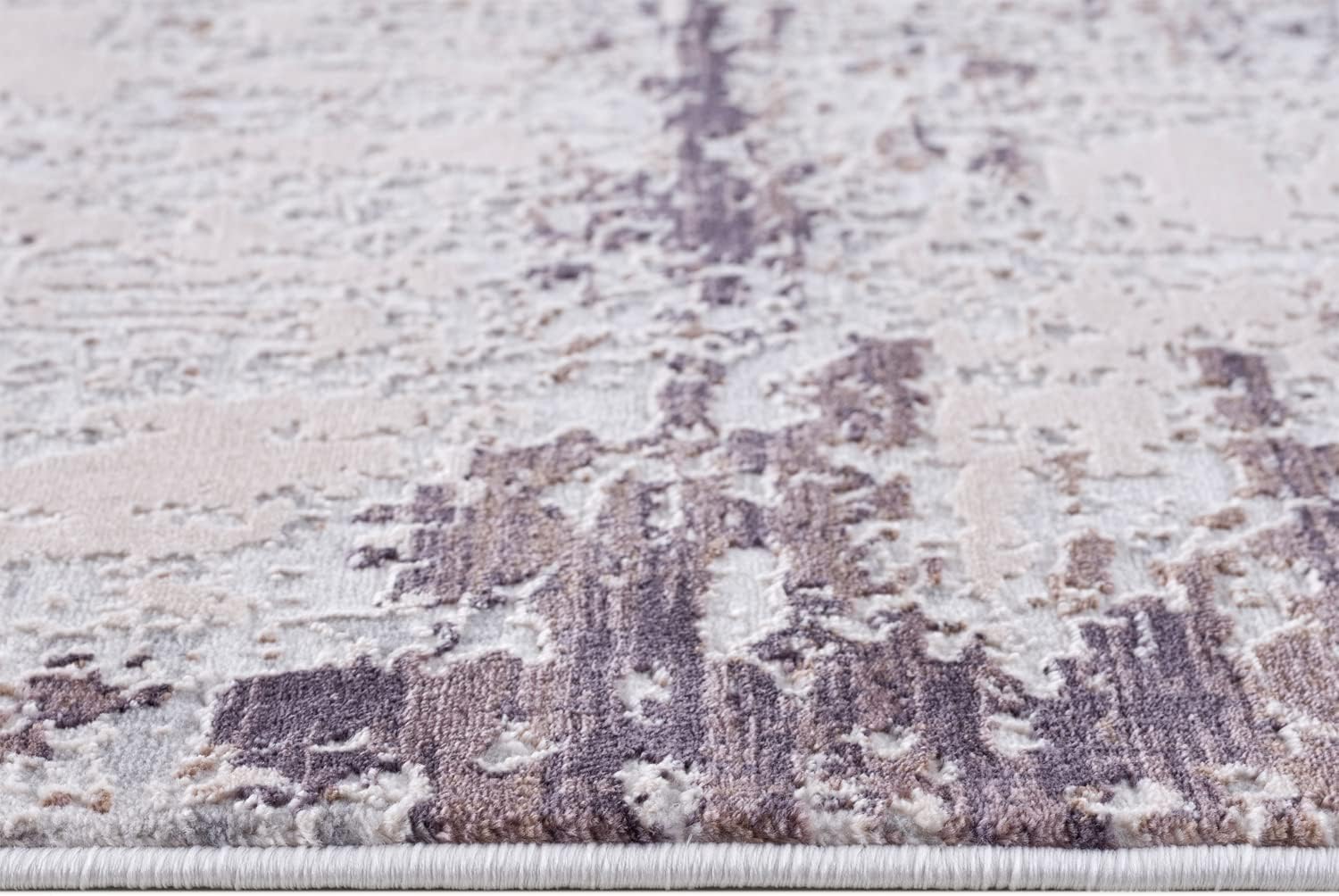 Close-up of textured abstract rug pattern.