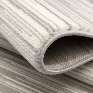 Close-up of folded gray striped carpet