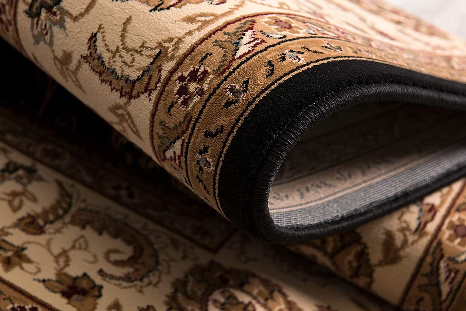 Rolled-up ornate beige Persian-style rug