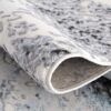 Close-up of folded patterned rug.