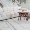 Modern white sofa with wooden coffee tables
