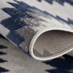 Folded geometric patterned textile fabric close-up
