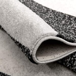 Close-up of folded black and white textured fabric.