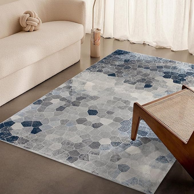 Modern living room with geometric patterned rug.