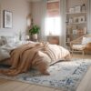 Cozy bedroom with beige decor and natural light.