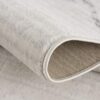 Close-up of a folded beige carpet edge