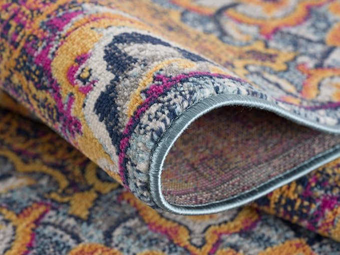 Colorful patterned rug close-up with intricate design.