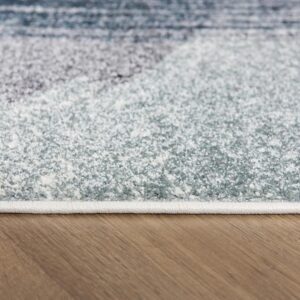 Close-up of textured rug on hardwood floor.