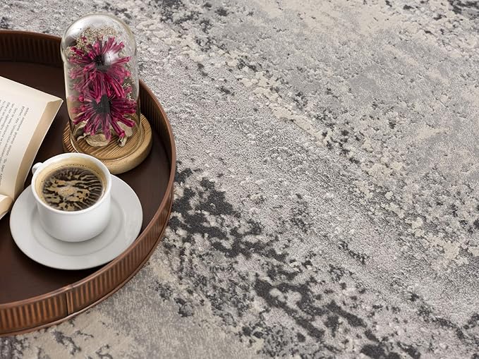 Coffee on tray with flower and book on carpet.
