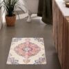 Colorful rug in modern bathroom setting