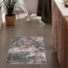 Geometric patterned rug in modern bathroom decor.