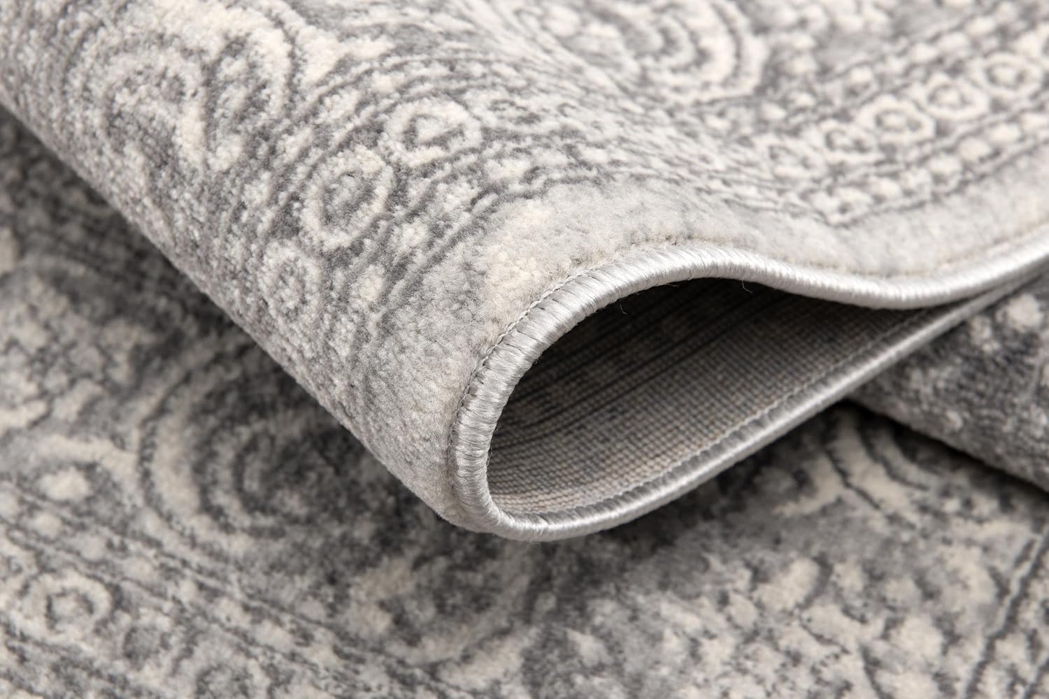 Close-up of textured gray patterned rug