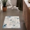 Modern bathroom with abstract design rug