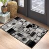 Geometric pattern rug beside window and plants