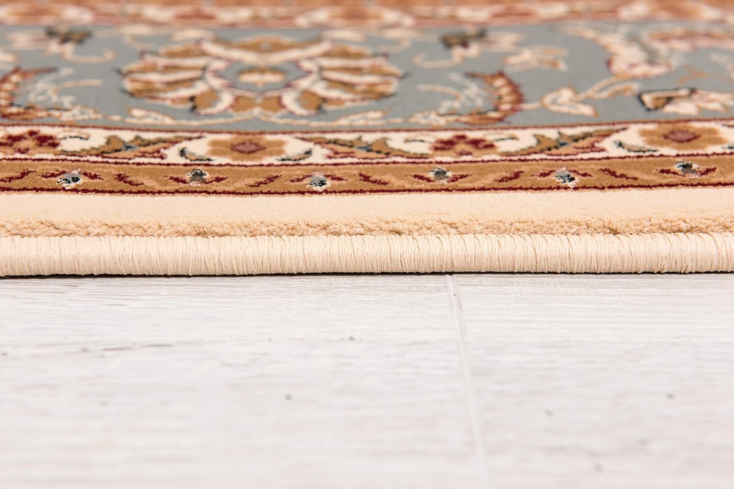 Close-up of decorative rug edge on floor