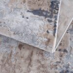 Abstract patterned gray and beige rug close-up