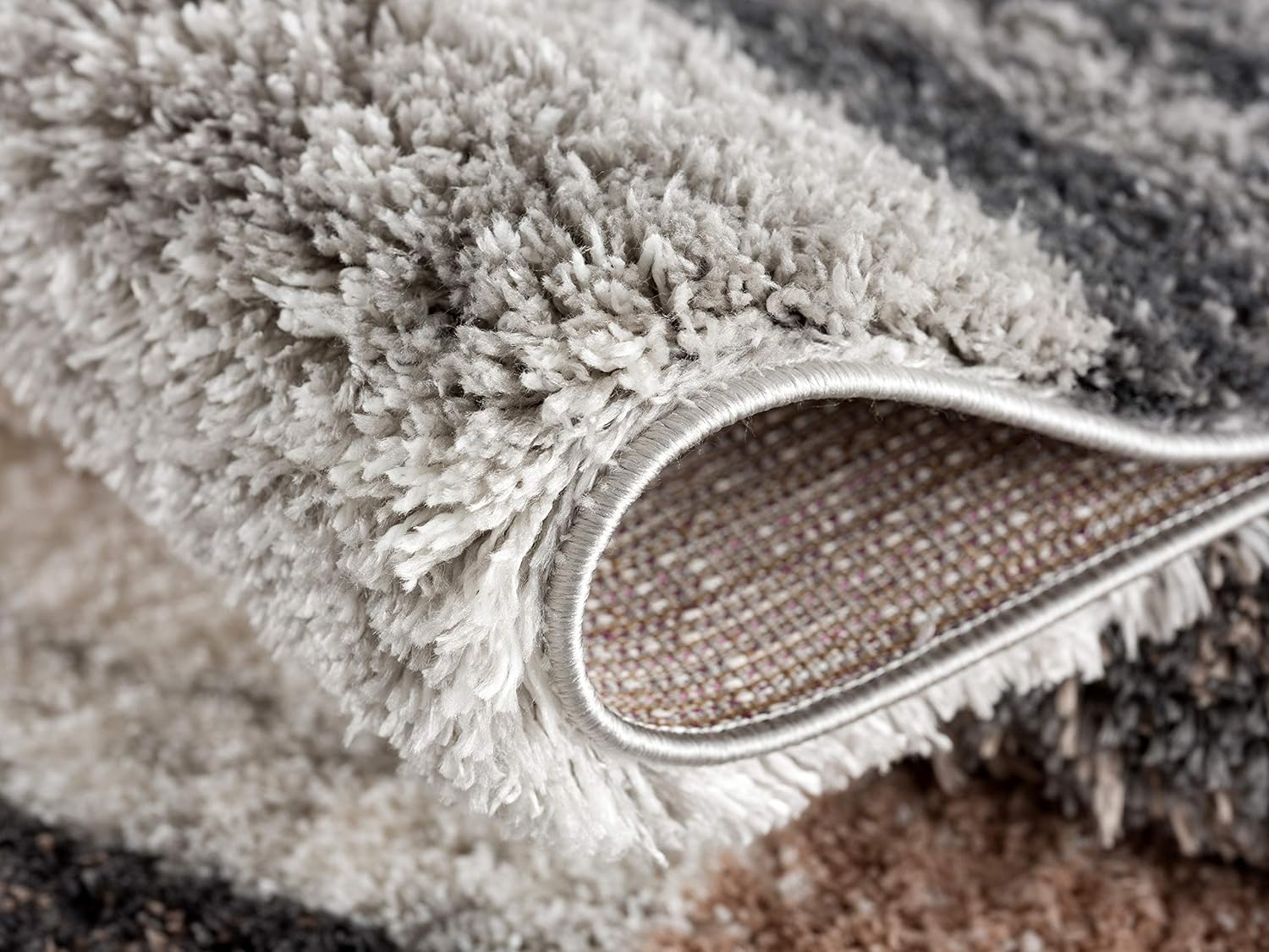 Close-up of grey and brown fluffy carpet