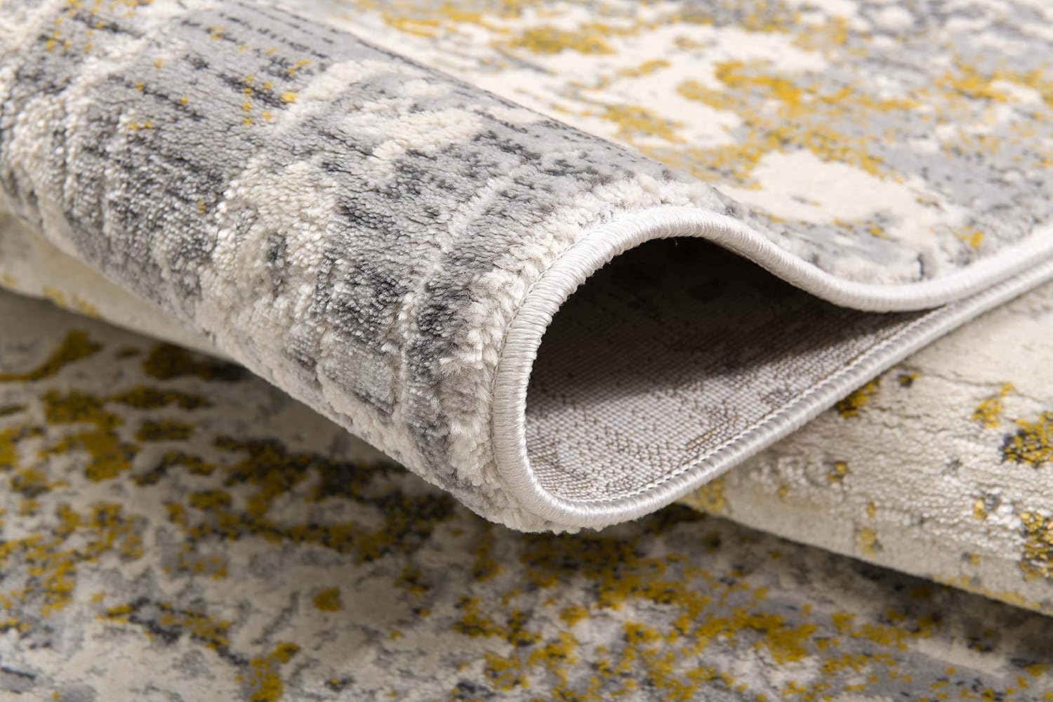 Gray and yellow textured rolled carpet close-up