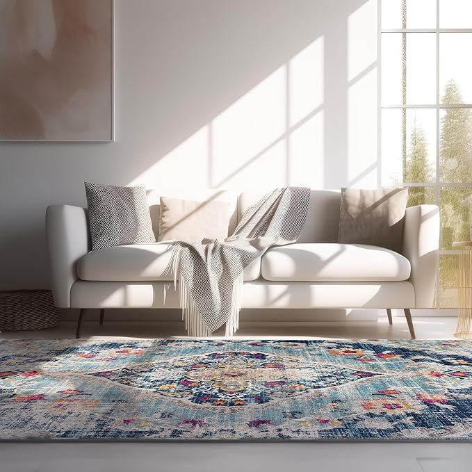 Cozy living room with couch, rug, and sunlight.
