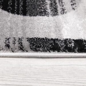 Close-up of a patterned rug edge on floor.