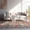 Cozy living room with colorful rug and sofa.