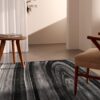 Modern living room with abstract gray rug.