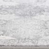 Close-up of gray patterned rug texture.
