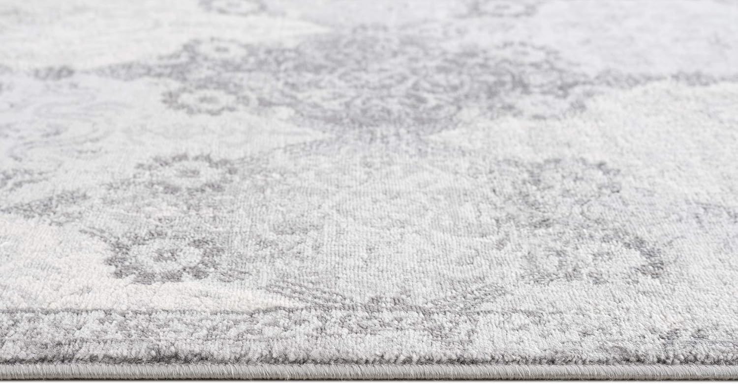 Close-up of gray patterned rug texture.