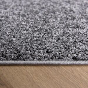Gray carpet on wooden floor close-up