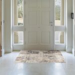 Elegant foyer with large white front door