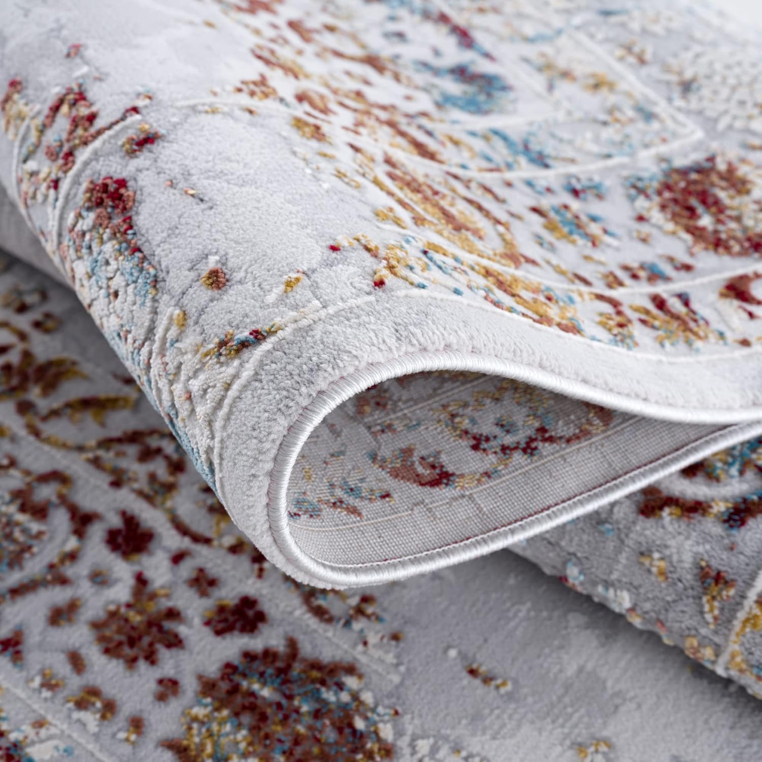 Rolled carpet with colorful abstract pattern