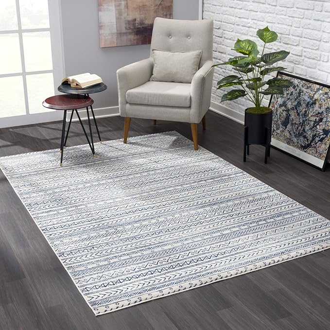 Modern living room with patterned rug and chair.