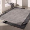 Modern gray rug in minimalistic room setting.
