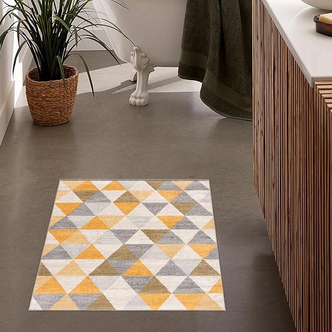 Geometric bathroom rug with triangles on floor