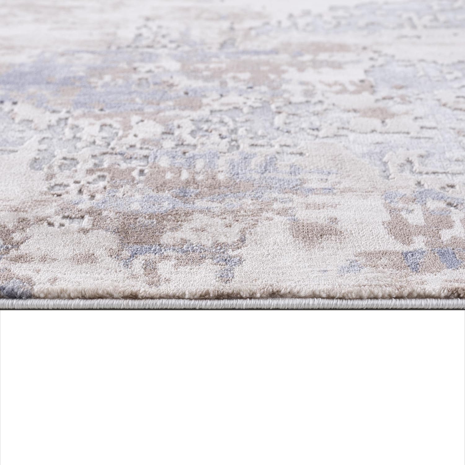 Textured beige and gray area rug close-up