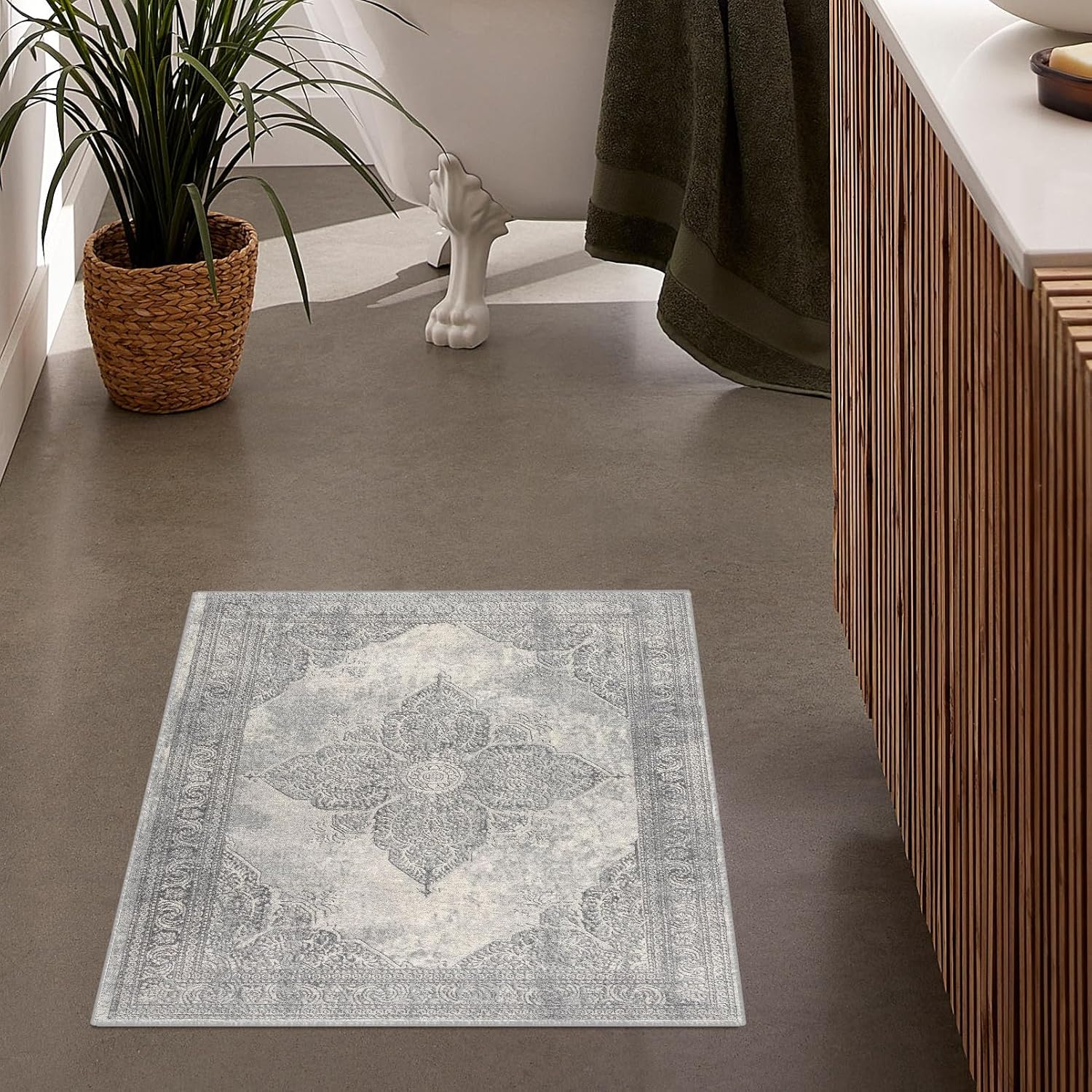 Stylish bathroom with decorative floor rug and plant
