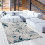 Modern living room with abstract rug and sofa.