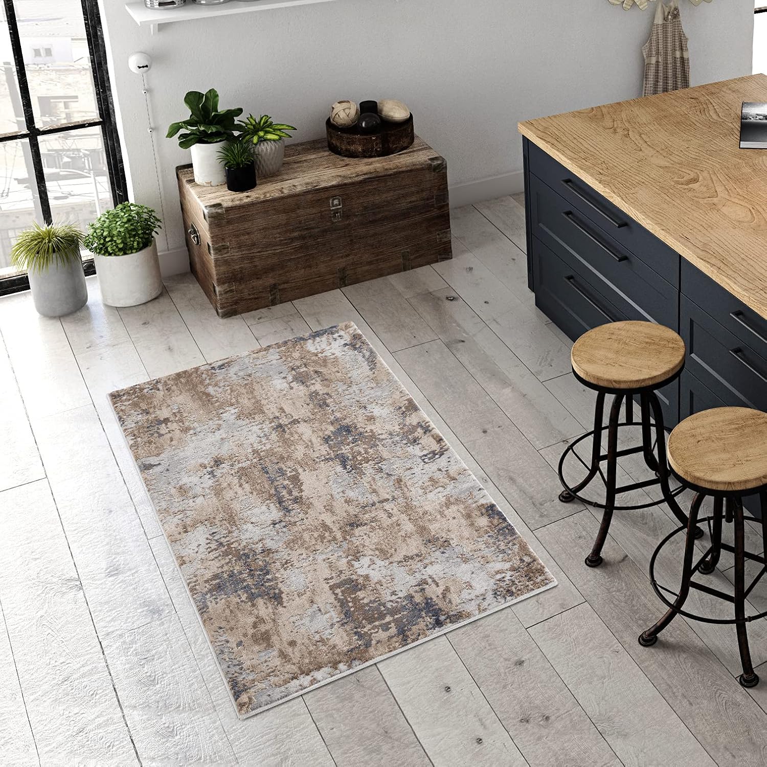 Modern kitchen with rustic rug and wooden accents.