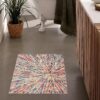 Colorful bathroom rug with abstract pattern.